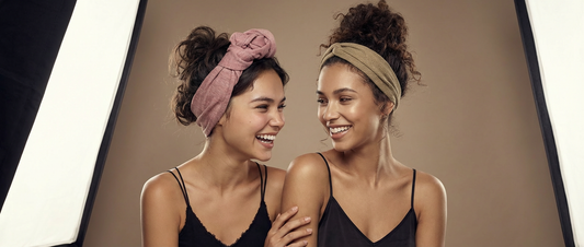 Two women smiling and showing 2 ways to style SWAY Long Stretch Headband