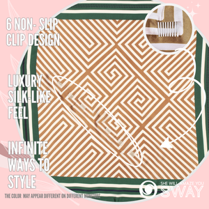 Gold & green geometric pattern satin scarf laid flat with clips