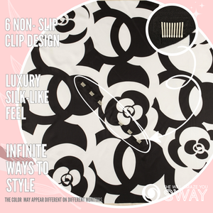 Close-up of Harlow Black twill satin scarf headband showing SWAY’s patented built-in non-slip clips