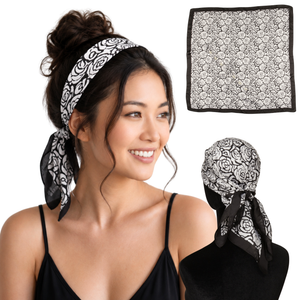 Woman wearing Milano Black rose print satin scarf headband, shown flat and tied from the back