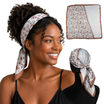 Woman wearing Florence Blue powder blue floral satin scarf headband, shown flat and tied from the back