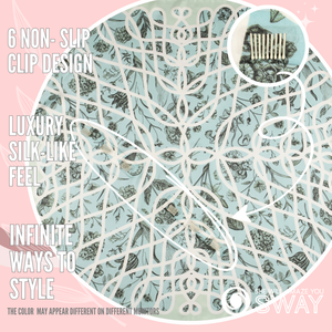 Versailles Aqua satin scarf headband laid flat with a close-up of SWAY’s patented non-slip clip