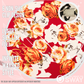 Red & white rose headband laid flat with writing showing clips