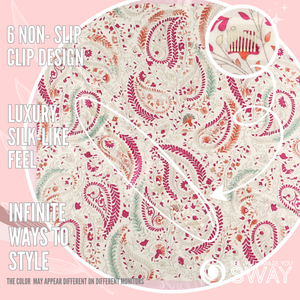 Juliet Pink scarf laid flat showing fuchsia and coral paisley and a close-up of the non-slip clip
