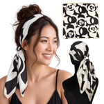 Woman wearing Harlow Black twill scarf headband with non-slip clips, shown flat and from the back