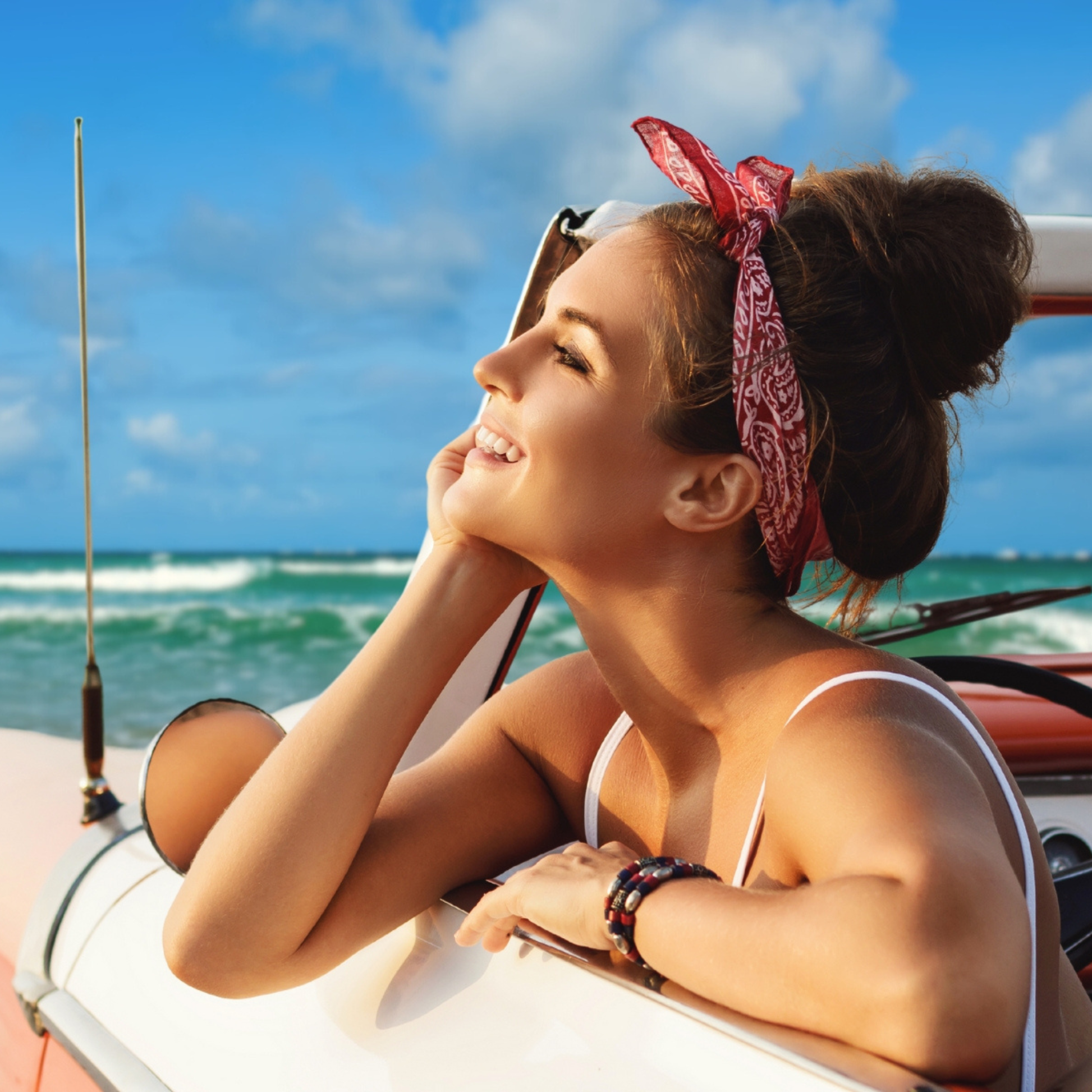 Woman with messy bun wearing a cotton bandana tied at top