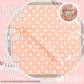 Pink polka dot pattern scarf laid flat showing clip design