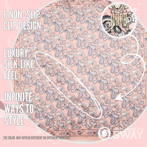 Pink and blue paisley silky head scarf laid flat with clips