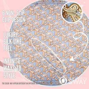 Baby blue paisley silky headband laid flat with clips