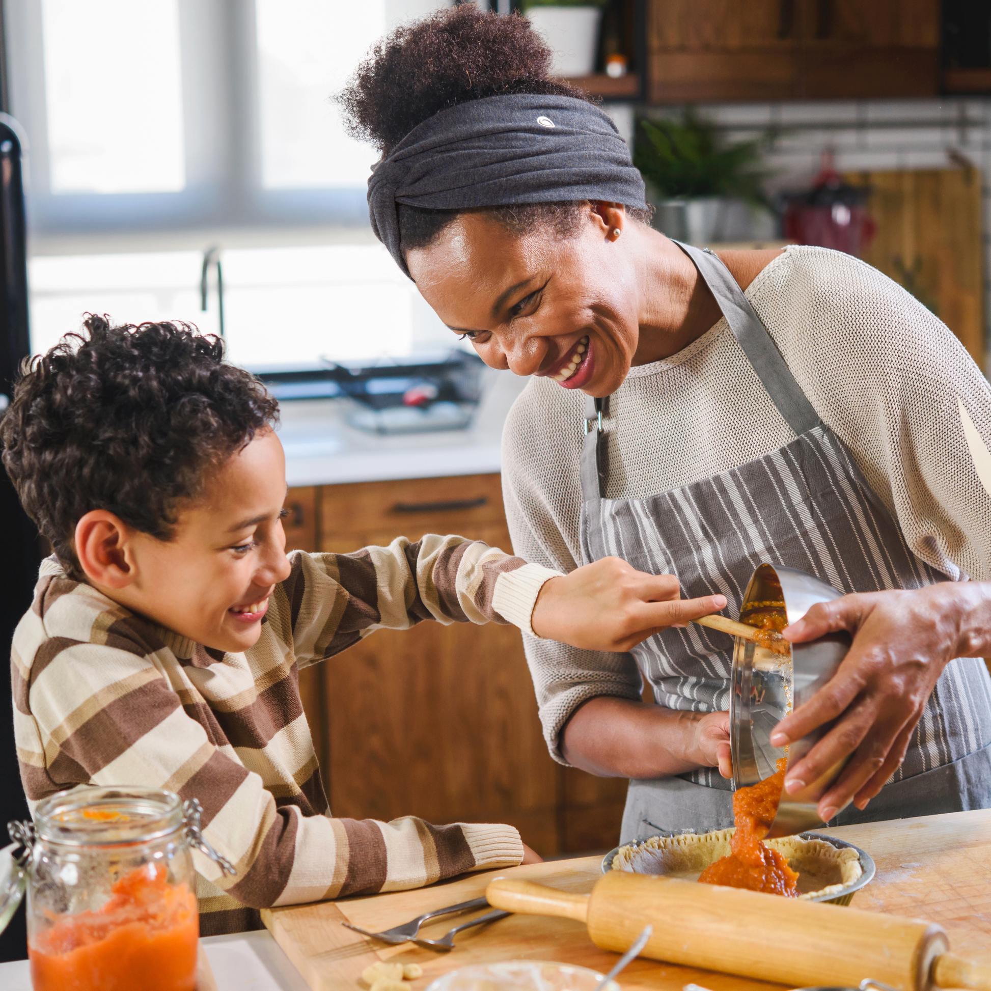 Woman in kitchen wearing SWAY non-slip long stretch headband 