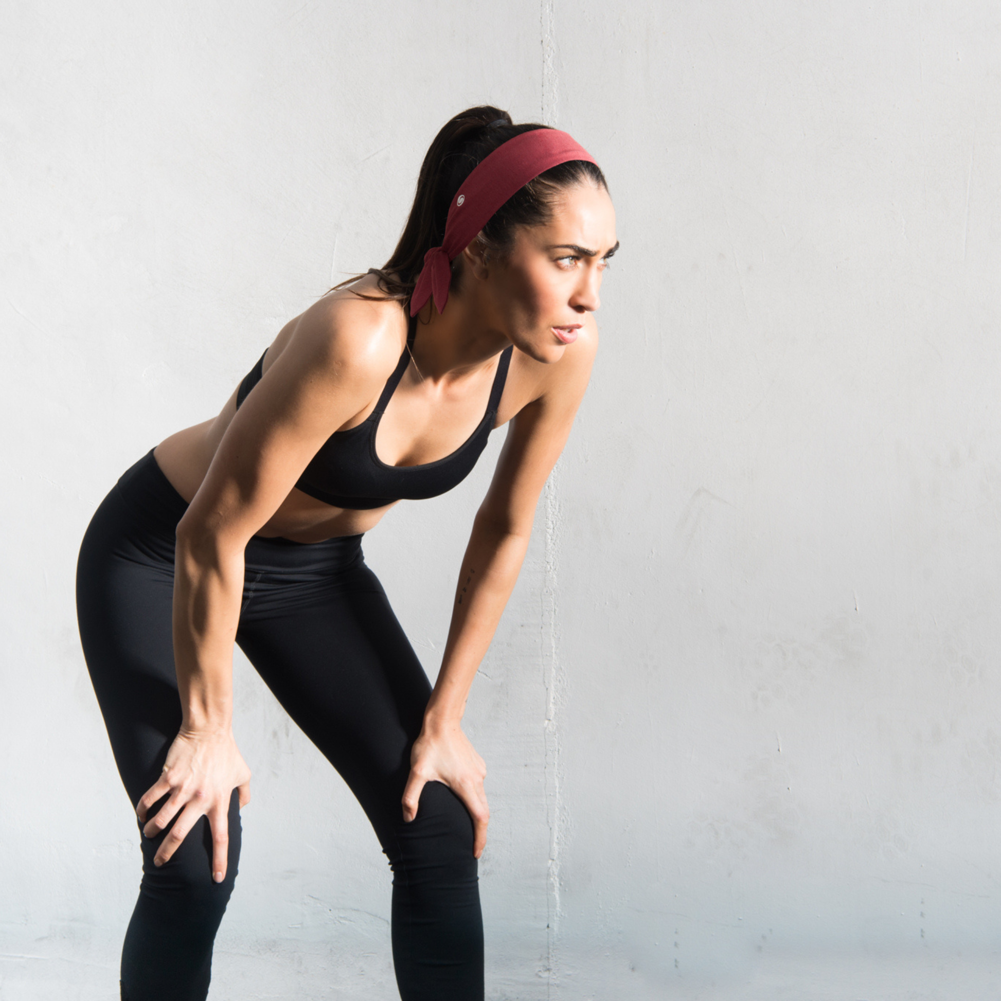 A runner wearing a moisture-wicking wide headband 